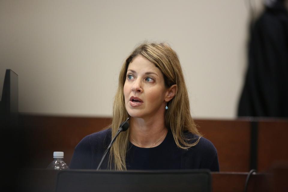 Wendi Adelson stares at a document displayed on a screen in the courtroom, Oct. 27, 2023.