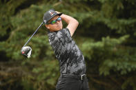 Rickie Fowler watches his tee shot on the second hole during the first round of the 3M Open golf tournament in Blaine, Minn., Thursday, July 22, 2021. (AP Photo/Craig Lassig)