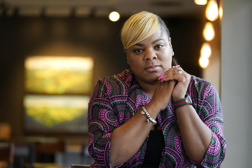 Tanita Hilliard sits for a portrait on Oct. 25, 2022, in Memphis, Tenn. When a young man live streamed himself driving around Memphis and shooting at people, she recognized the man as Ezekiel Kelly, one of her former middle school students. Kelly is accused of killing three people and injuring three others. (AP Photo/Mark Humphrey)