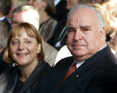 <p>Former German Chancellor Helmut Kohl (R) sits next to Christian Democrat party (CDU) leader Angela Merkel (L) during celebrations to mark the 10th anniversary of German unification in Berlin September 27, 2000. (Michael Urban/Reuters) </p>