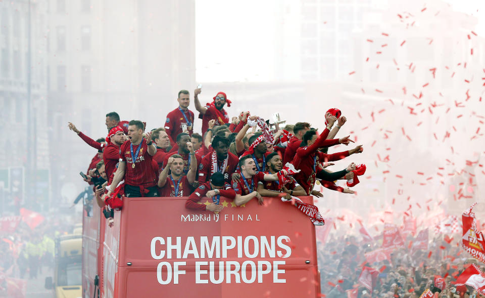 Liverpool players and staff on the bus during the Champions League Winners Parade in Liverpool.