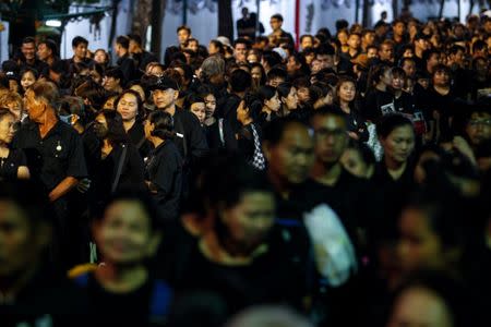Mourners queue as they attend the Royal Cremation ceremony of Thailand's late King Bhumibol Adulyadej near the Grand Palace in Bangkok, Thailand, October 25, 2017. REUTERS/Kerek Wongsa