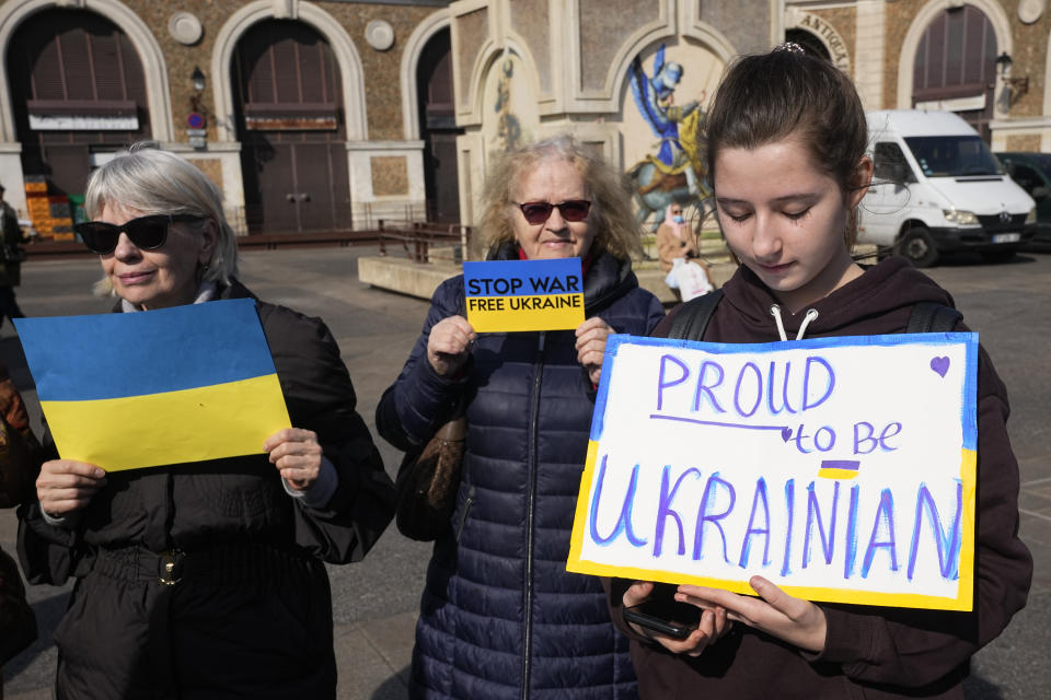 A group of Ukrainian protesters demonstrate near the Chateau de Versailles, where a European Union summit will take place, Thursday, March 10, 2022 in Versailles, west of Paris. With European nations united in backing Ukraine's resistance with unprecedented economic sanctions, three main topics now dominate the agenda: Ukraine's application for fast-track EU membership; how to wean the bloc off its Russian energy dependency; and bolstering the region's defense capabilities. (AP Photo/Michel Euler)