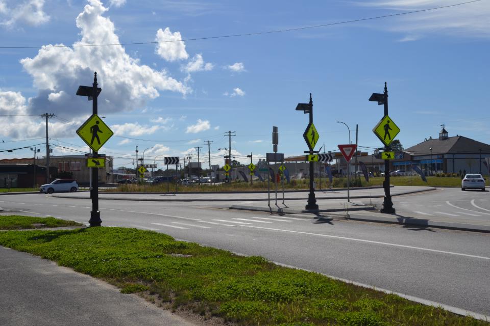 Vehicles travel through the new roundabout connecting Newport's North End with downtown.