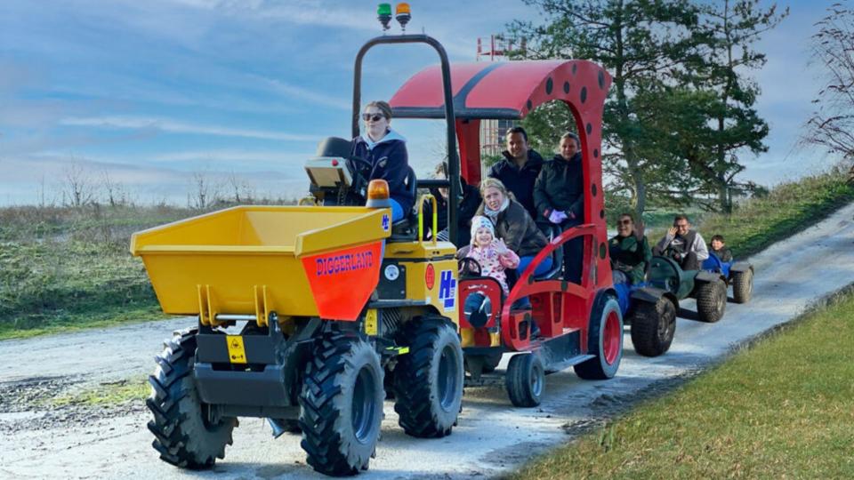 Days out in Kent illustrated by yellow digger train with peole on