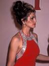 <p>Glam supermodels including Cindy Crawford popularized over-the-top updos with face-framing pieces.</p>