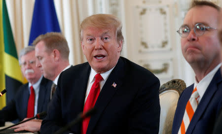 U.S. President Donald Trumps, seated with acting White House chief of staff Mick Mulvaney (R), acting Defense Secretary Patrick Shanahan (2nd L) and National Security adviser John Bolton (L) speaks during a meeting with the leaders of The Bahamas, the Dominican Republic, Haiti, Jamaica and Saint Lucia at his Mar-a-Lago estate in Palm Beach, Florida, U.S., March 22, 2019. REUTERS/Kevin Lamarque