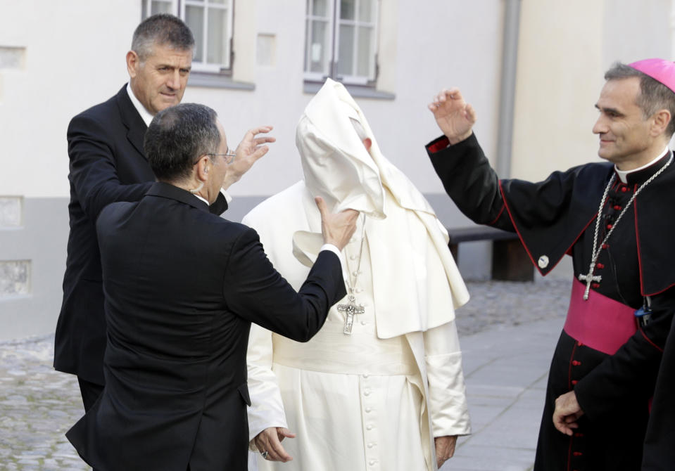 A gust of wind blows Pope Francis' mantle as he arrives to a meeting with people assisted by the church in the Cathedral of Saints Peter and Paul in Tallinn, Estonia, Tuesday, Sept. 25, 2018. Pope Francis concludes his four-day tour of the Baltics visiting Estonia. (AP Photo/Andrew Medichini)