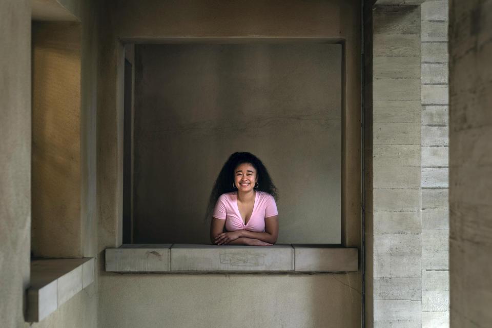 Marina Aina, a 21-year-old student majoring in American Studies at Pomona College, poses for photos on the school's campus in Claremont, Calif., Thursday, Sept. 22, 2022. Aina was used to getting paid for her internships and could not see taking an unpaid opportunity over a summer job. "If I felt that it wasn't compensated then I wouldn't go for it because I wouldn't have the funds to cover it," Aina says. "I wouldn't want to ask my parents, who are helping me pay for college, to pay for something I'm doing over the summer." (AP Photo/Jae C. Hong)