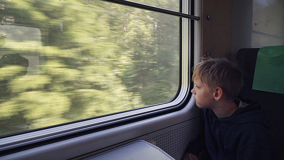 11-year-old Gabriel Bjorstrand looks out of the train window on the first of many trains on a whistle-stop vacation around northern Europe in Nykoping, on Saturday, June 15, 2019. Gabriel says he liked train journeys because he gets to spend time with his family, especially his brother. (AP Photo/David Keyton)