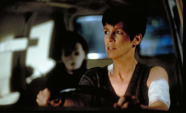 Jamie Lee Curtis as Laurie Strode with Michael Myers in the backseat in "Halloween H20: 20 Years Later"<p>Dimension Films</p>