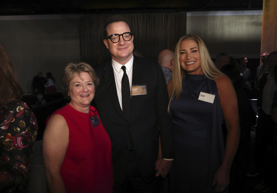 Bonnie Arnold, from left, Brendan Fraser, and Jeanne Moore attend the 95th Academy Awards Nominees Luncheon on Monday, Feb. 13, 2023, at the Beverly Hilton Hotel in Beverly Hills, Calif. (Photo by Willy Sanjuan/Invision/AP)