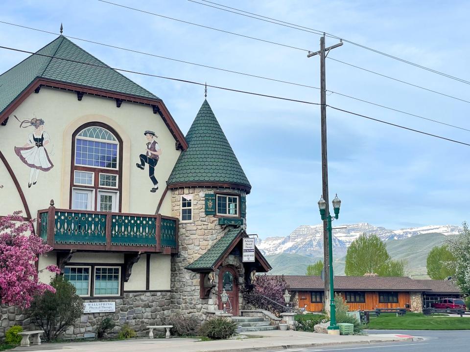 A building with a Swiss-themed mural.