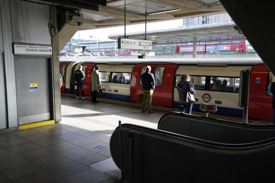 Commuters at Canning Town underground station in London, after the Prime Minister Boris Johnson said people who cannot work from home should be "actively encouraged" to return to their jobs from Monday.