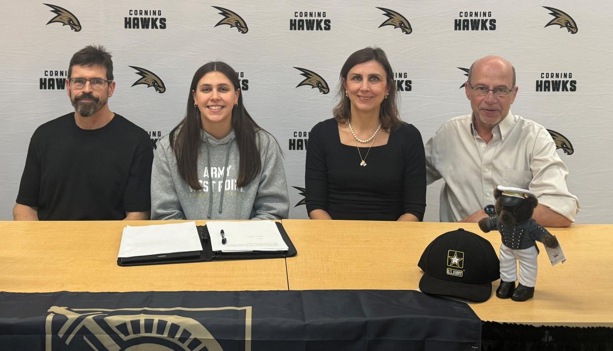 Corning senior Angie McKane was celebrated during a signing ceremony March 27, 2024 at Corning-Painted Post High School's cafeteria. Also pictured are her parents, Adam McKane and Natalia Hartmann, and her stepdad, Volker Hartmann (far right).