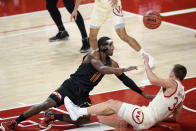 Wisconsin guard Brad Davison (34) fouls Maryland guard Darryl Morsell (11) during the first half of an NCAA college basketball game Wednesday, Jan. 27, 2021, in College Park, Md. (AP Photo/Nick Wass)