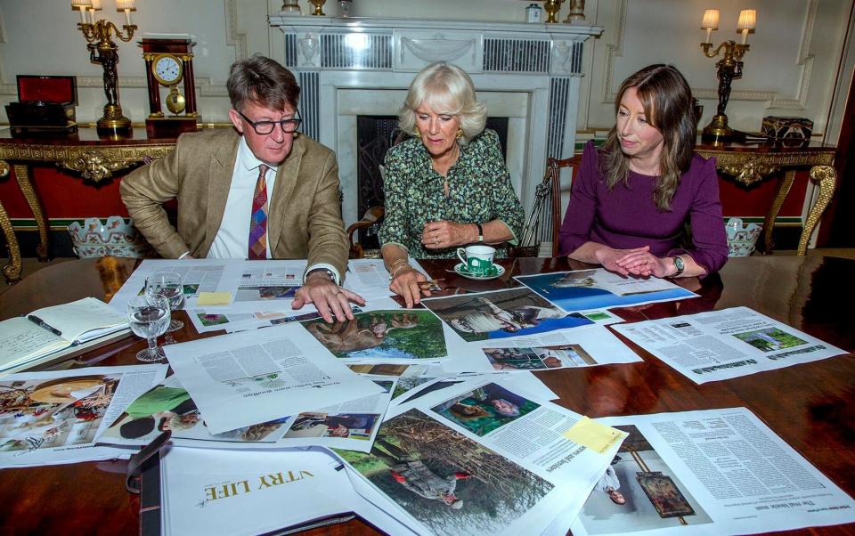 The Duchess of Cornwall looks through page proofs before publication with editor-in-chief Mark Hedges and managing and features editor Paula Lester - Mark Williamson