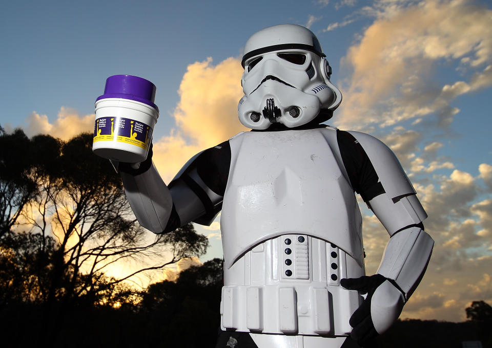 PERTH, AUSTRALIA - JULY 15: Stormtrooper Paul French is pictured on day 5 of his over 4,000 kilometre journey from Perth to Sydney holding his collection tin on Old Mandurah Road on July 15, 2011 in Perth, Australia. French aims to walk 35-40 kilometres a day, 5 days a week, in full Stormtrooper costume until he reaches Sydney. French is walking to raise money for the Starlight Foundation - an organisation that aims to brighten the lives of ill and hostpitalised children in Australia. (Photo by Paul Kane/Getty Images)