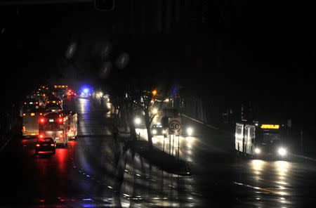 Cars and buses drive in the central business district (CBD) of Adelaide after severe storms and thousands of lightning strikes knocked out power to the entire state of South Australia, September 28, 2016. Picture taken September 28, 2016. AAP/David Mariuz/via REUTERS