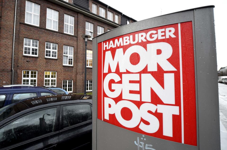 A sign for the German newspaper Hamburger Morgenpost is pictured in front of its building in Hamburg January 11, 2015. The building was the target of an arson attack and two suspects were arrested, police said on Sunday. Like many other German newspapers, Hamburger Morgenpost has printed cartoons of French satire magazine Charlie Hebdo after the deadly attack on Wednesday in Paris. A police spokeswoman said that an incendiary device was thrown at the newspaper building in the night and documents were burned inside. REUTERS/Fabian Bimmer (GERMANY - Tags: CIVIL UNREST MEDIA CRIME LAW)