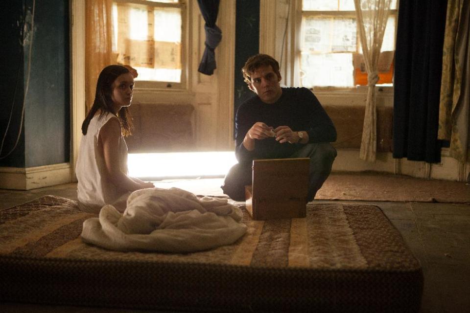 This image released by Lionsgate shows Olivia Cooke, left, and Sam Claflin in a scene from "The Quiet Ones." (AP Photo/Lionsgate, Chris Harris)