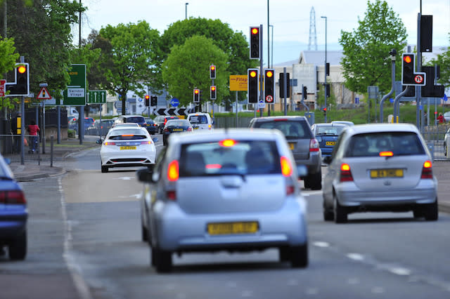 Traffic lights on the roundabout at the junction of Kingsditch Road and Tewkesbury Road part of the inner ring road in Cheltenham, Gloucestershire.