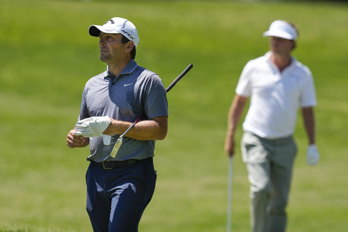 Francesco Molinari, of Italy, left, walks to the first green during the third round of the Memorial golf tournament Saturday, June 4, 2022, in Dublin, Ohio. (AP Photo/Darron Cummings)