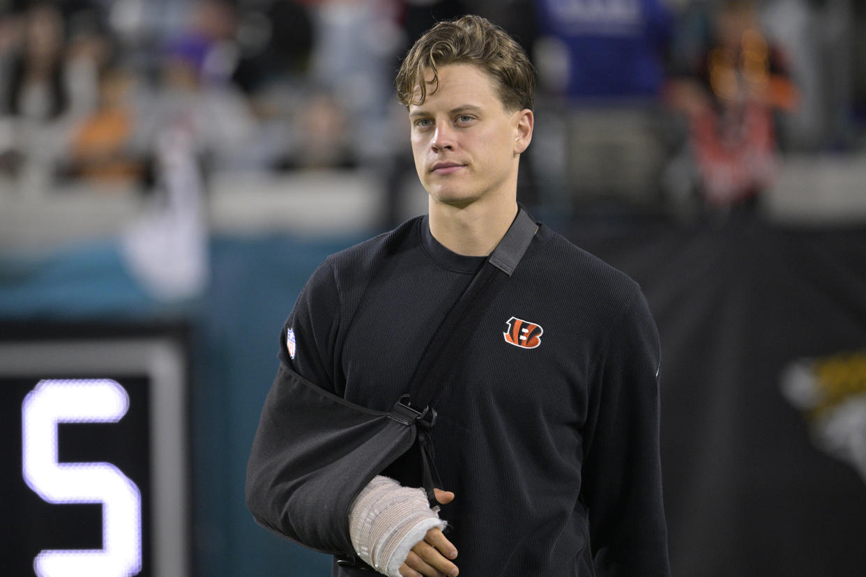 Cincinnati Bengals quarterback Joe Burrow walks along the sideline before an NFL football game against the Jacksonville Jaguars, Monday, Dec. 4, 2023, in Jacksonville, Fla. (AP Photo/Phelan M. Ebenhack)