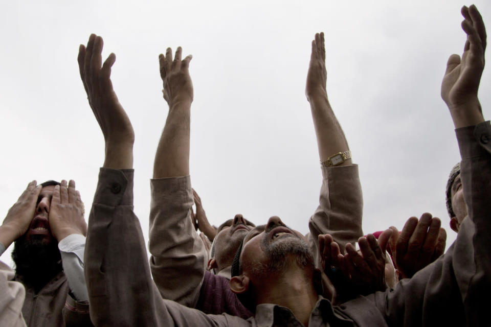 Kashmiri Muslims pray as the head priest displays a relic of Islam’s Prophet Muhammad at the Hazratbal shrine following Mehraj-u-Alam, believed to mark the ascension of the prophet to heaven, in Srinagar, Indian controlled Kashmir, May 5, 2016. Thousands of Kashmiri Muslims gathered at the Hazratbal shrine, which houses a relic believed to be a hair from the beard of the prophet. (Dar Yasin/AP)