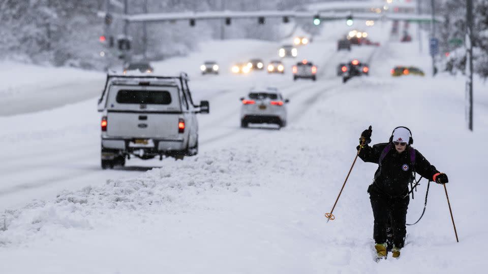Jodie Gallamore cross-country skis along Tudor Road after a heavy snowfall in Anchorage on Thursday, November 9, 2023. - Marc Lester/Anchorage Daily News/AP