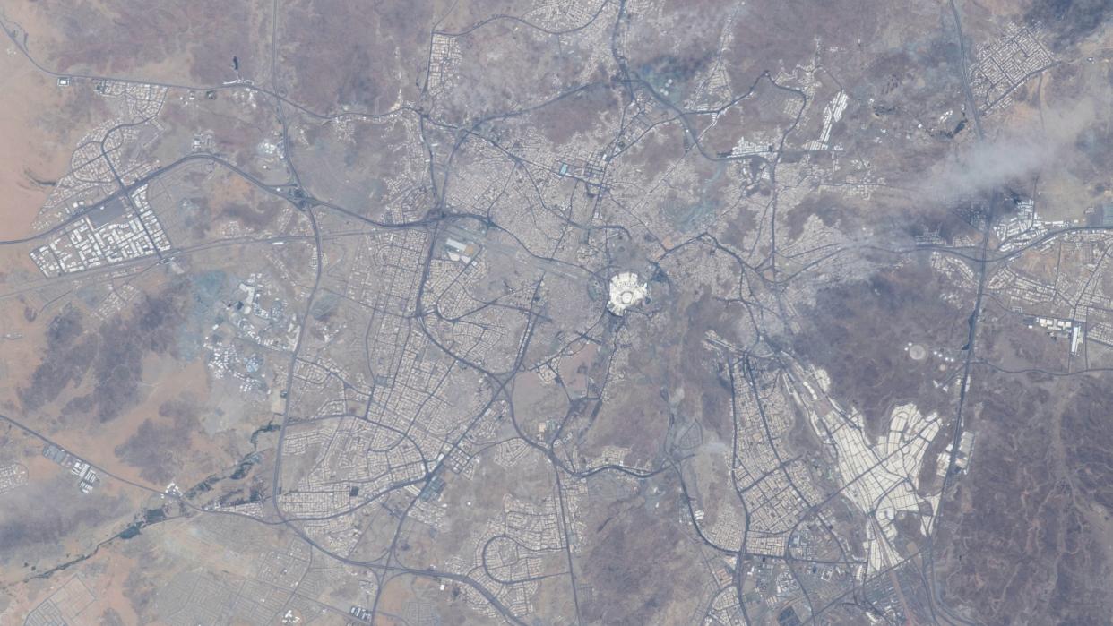  overhead view of mecca with lots of roads and desert 