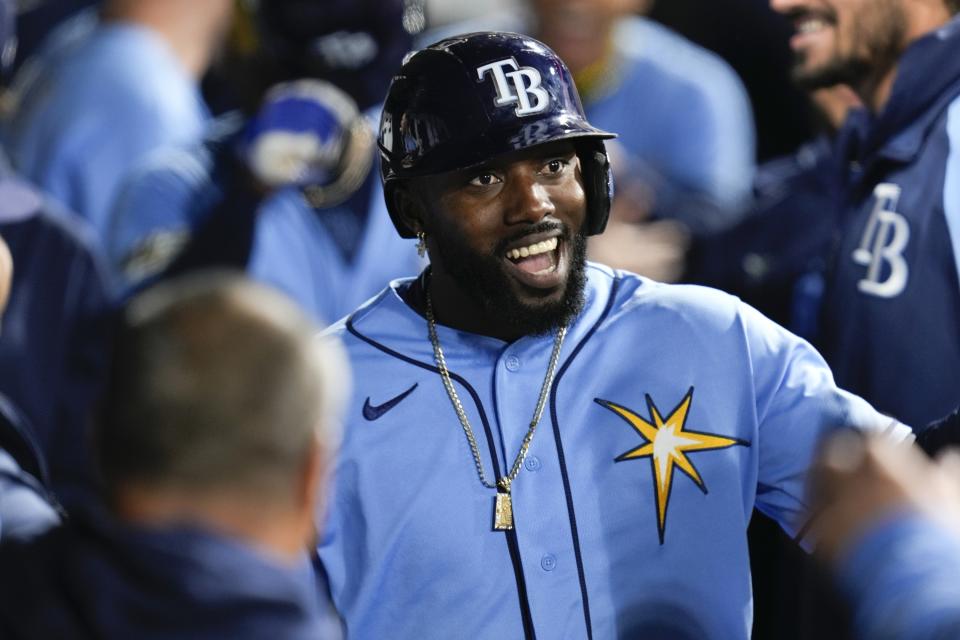 Tampa Bay Rays' Randy Arozarena celebrates in the dugout after homering during the seventh inning of a baseball game against the Chicago White Sox Saturday, April 29, 2023, in Chicago. (AP Photo/Erin Hooley)