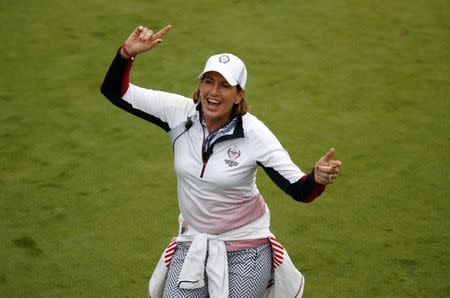 Aug 19, 2017; West Des Moines, IA, USA; USA captain Juli Inkster dances on the first tee box during the second round morning session during The Solheim Cup international golf tournament at Des Moines Golf and Country Club. Mandatory Credit: Brian Spurlock-USA TODAY Sports