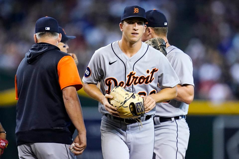 Tigers manager A.J. Hinch, left, takes the baseball from pitcher Beau Brieske, right, during the fourth inning on Sunday, June 26, 2022, in Phoenix.