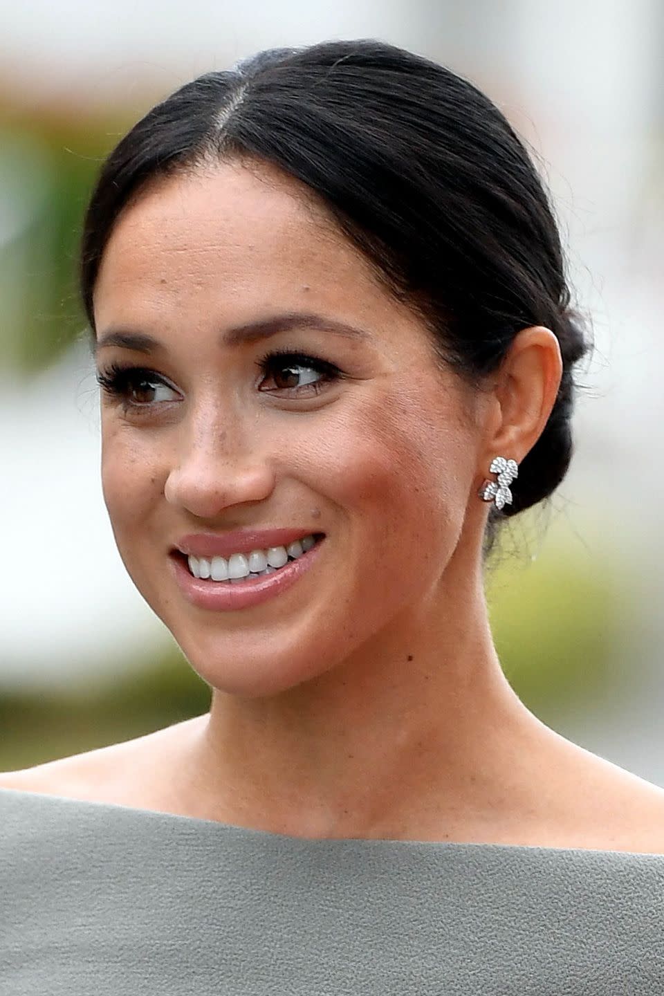 Meghan with a neat centre-parted bun in 2018