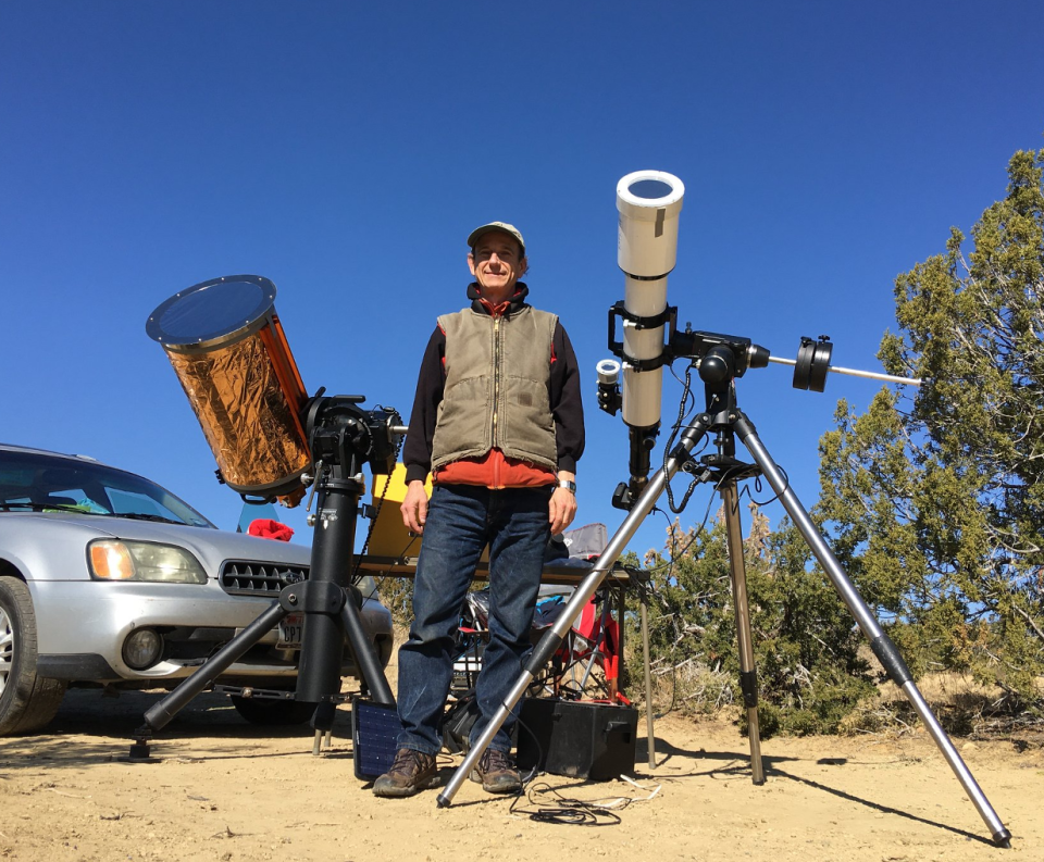 Joseph Izen pictured at El Pais National Monument in New Mexico in 2019. For this year's eclipse, he'll be towing a trailer of telescopes and other gear to a ranch near Durango, Mexico.