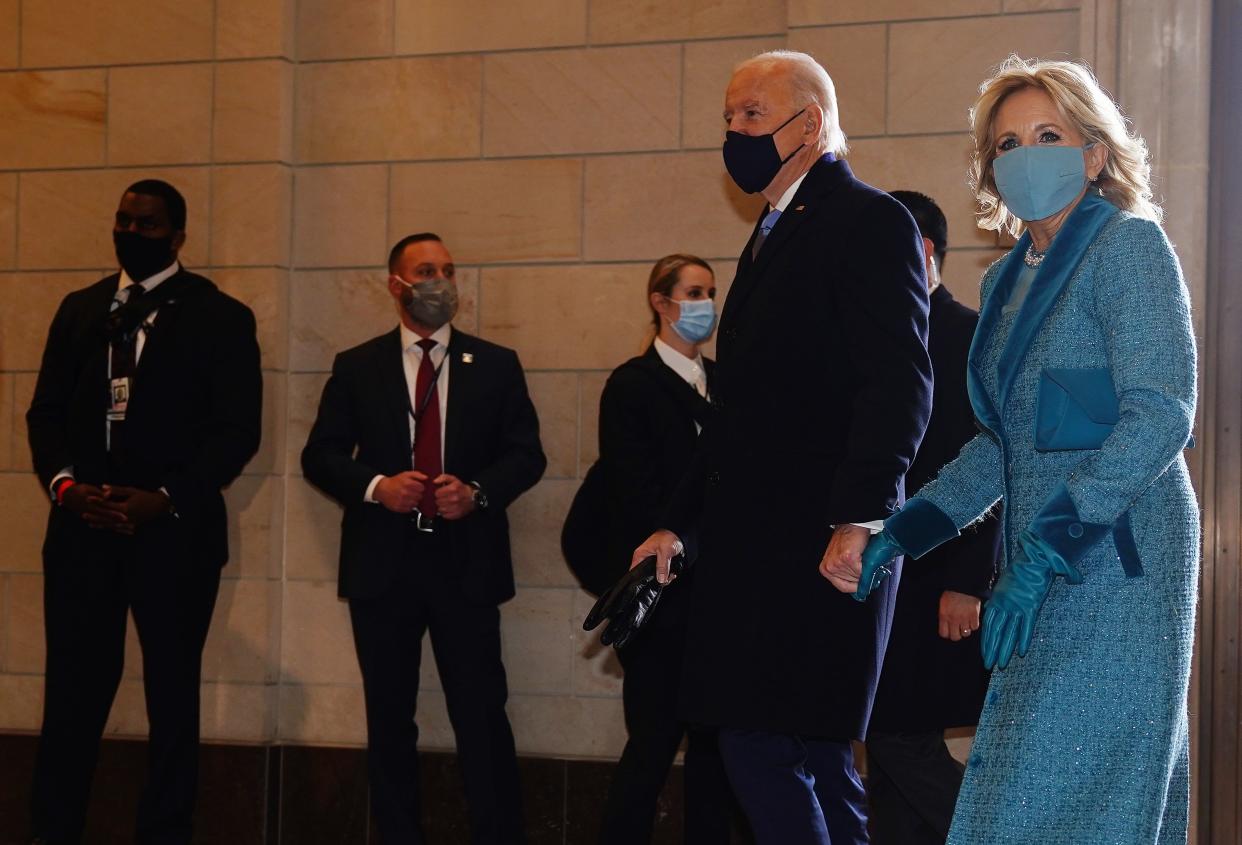 President-elect Joe Biden (C) and incoming US First Lady Jill Biden (R) arrive at the East Front of the US Capitol for his inauguration ceremony to be the 46th President of the United States in Washington, DC, on January 20, 2021. (Photo by JIM LO SCALZO / POOL / AFP) (Photo by JIM LO SCALZO/POOL/AFP via Getty Images)