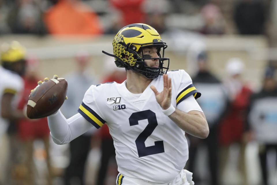 Michigan quarterback Shea Patterson (2) throws during the first half of an NCAA college football game against Indiana, Saturday, Nov. 23, 2019, in Bloomington, Ind. (AP Photo/Darron Cummings)