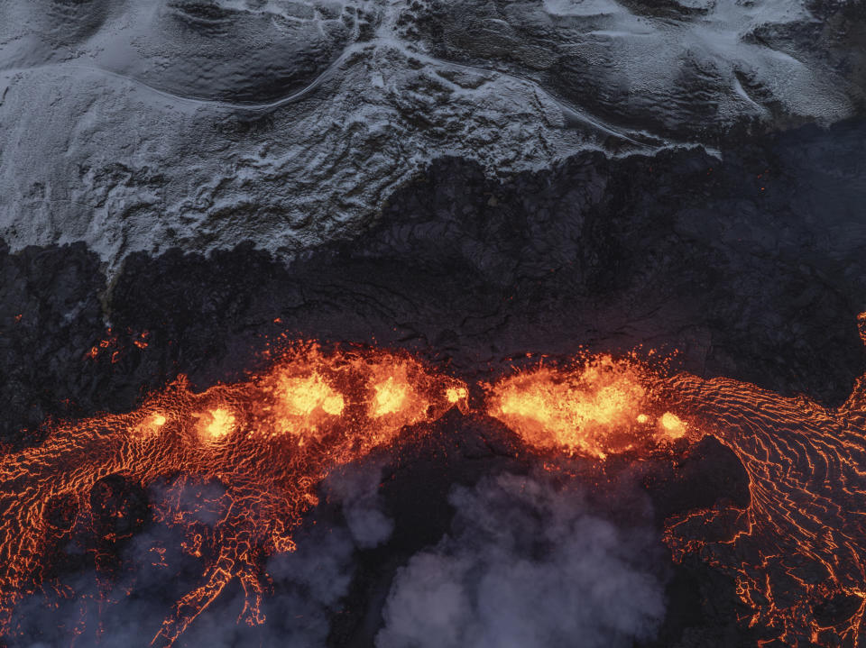 An aerial view of volcanic activity on the active volcano in Grindavik on Iceland's Reykjanes Peninsula, Tuesday, Dec. 19, 2023. (AP Photo/Marco Di Marco)