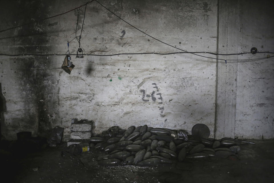 Mortars are piled up inside a weapon factory in Mosul