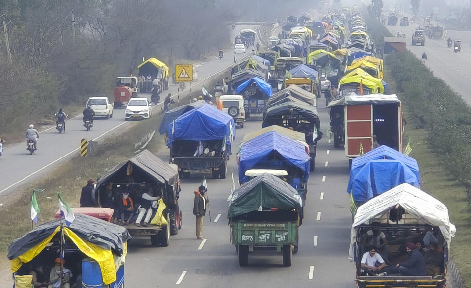 Farmers on tractors march to New Delhi near the Punjab-Haryana border at Shambhu, India, Tuesday, Feb.13, 2024. Farmers are marching to the Indian capital asking for a guaranteed minimum support price for all farm produce. (AP Photo/Rajesh Sachar)