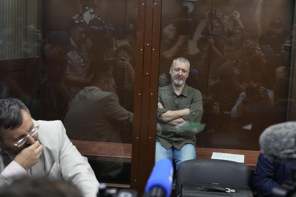 Igor Girkin also know as Igor Strelkov, the former military chief for Russia-backed separatists in eastern Ukraine sits in a glass cage in a courtroom at the Moscow's Meshchansky District Court in Moscow, Russia, Friday, July 21, 2023. A prominent Russian hard-line nationalist who accused President Vladimir Putin of weakness and indecision in Ukraine was detained Friday on charges of extremism, a signal the Kremlin has toughened its approach with hawkish critics after last month's abortive rebellion by the Wagner mercenary company. (AP Photo/Alexander Zemlianichenko, Pool)