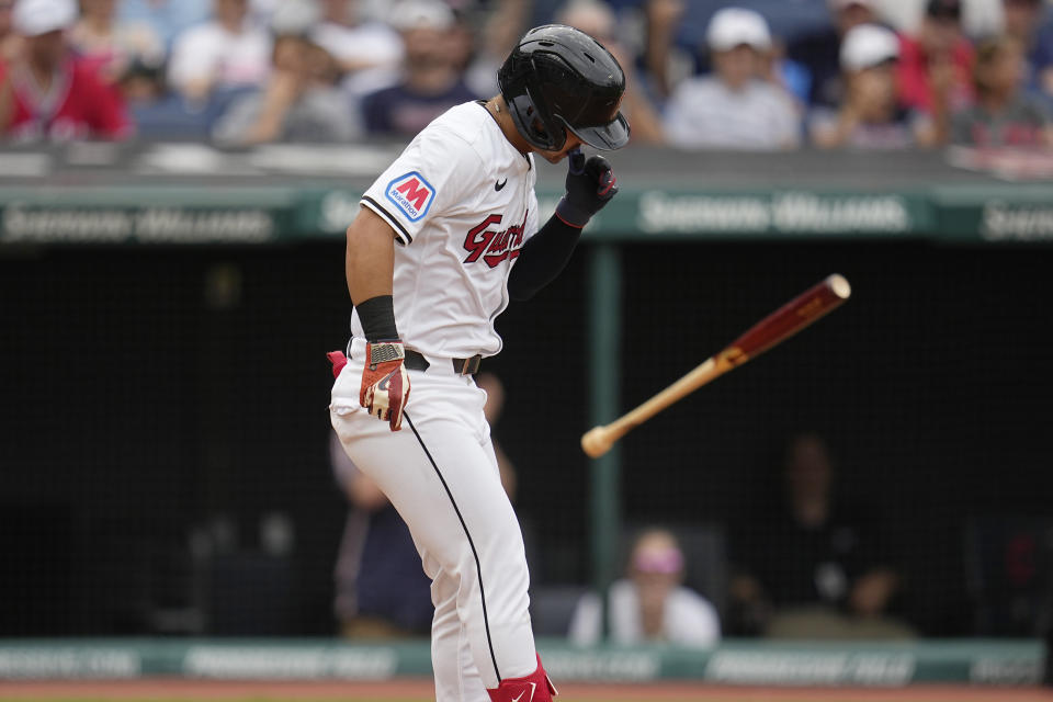 Cleveland Guardians' Steven Kwan flips his bat as he walks, and walks in a run, in the fifth inning of a baseball game against the Chicago White Sox, Thursday, July 4, 2024, in Cleveland. (AP Photo/Sue Ogrocki)