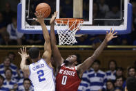 Duke guard Cassius Stanley (2) shoots while North Carolina State forward D.J. Funderburk (0) defends during the first half of an NCAA college basketball game in Durham, N.C., Monday, March 2, 2020. (AP Photo/Gerry Broome)