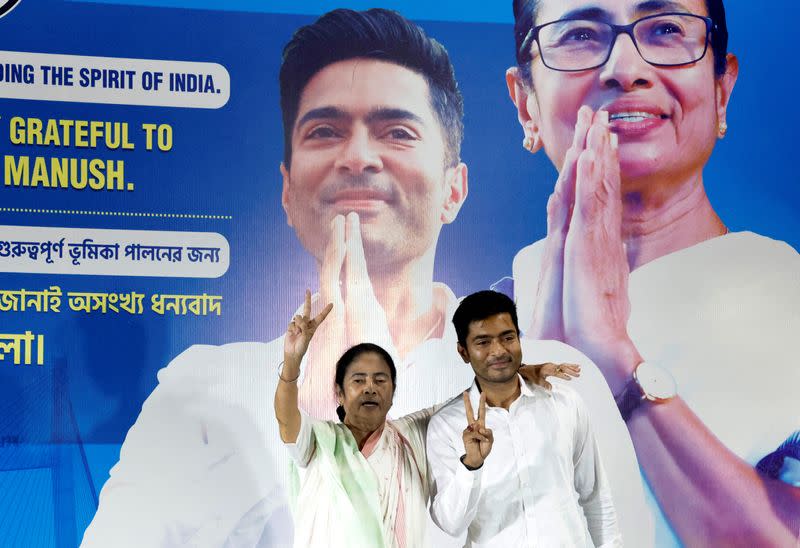 Chief Minister of West Bengal Mamata Banerjee and her nephew Abhishek Banerjee gesture in Kolkata