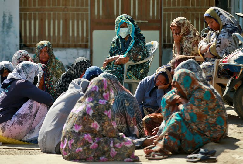 Relatives of Jagdish Baldevbhai Patel mourn in Dingucha village