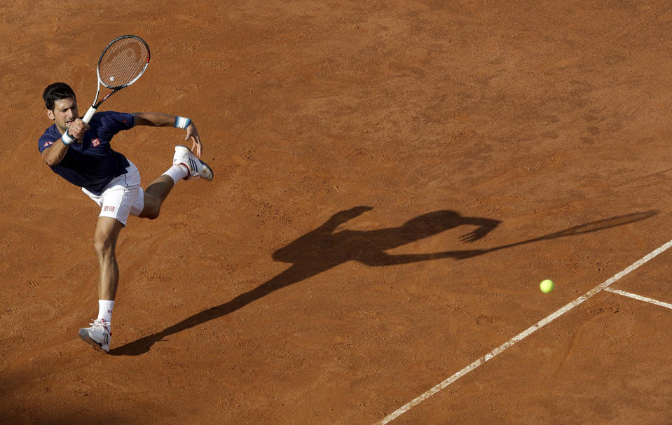 Novak Djokovic returns the ball