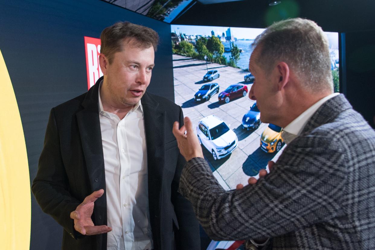 Tesla's Elon Musk and VW's Herbert Diess