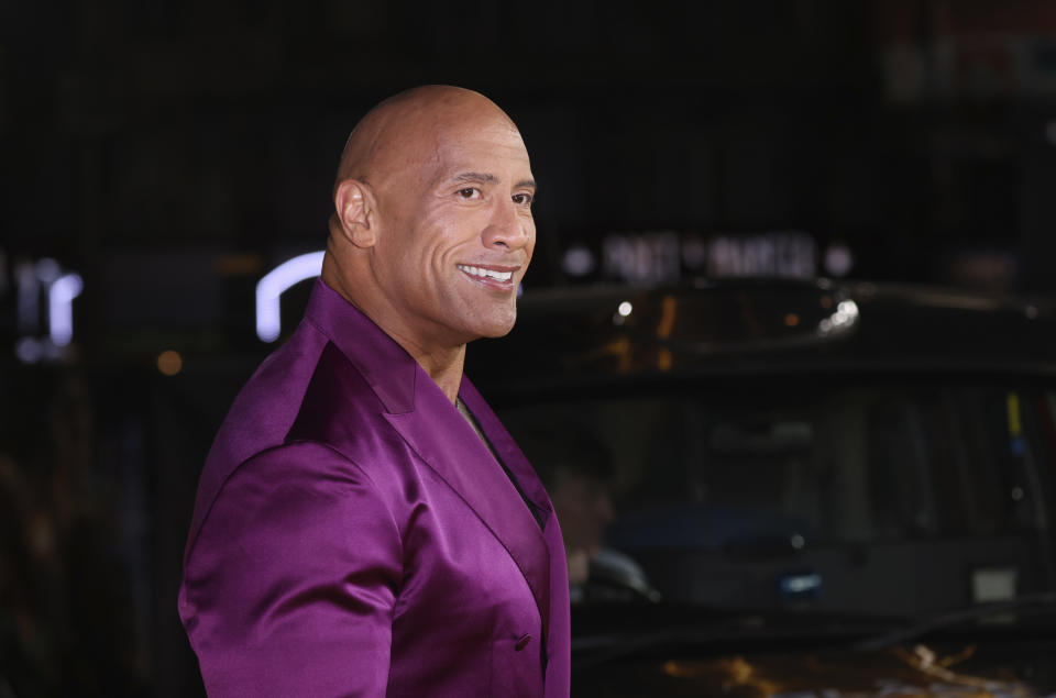 Dwayne Johnson poses for photographers upon arrival for the premiere of the film 'Black Adam' on Tuesday, Oct. 18, 2022, in London. (Photo by Vianney Le Caer/Invision/AP)