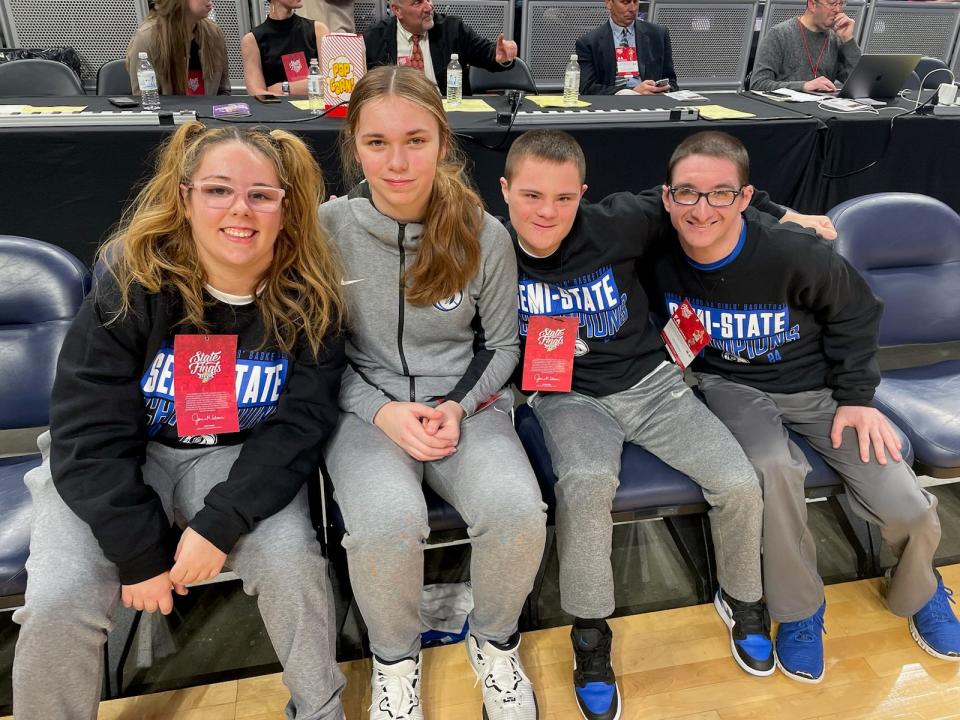L-R: Lake Central student managers Alexa Wellman, Mayah Grigsby, Brendan Huppenthal and Nic Rossi pose for a photo before the Class 4A state championship game on Saturday, Feb. 24, 2024 at Gainbridge Fieldhouse.